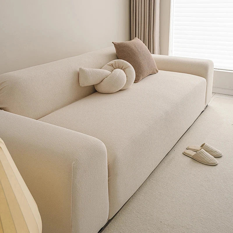 Housse de canapé extensible haut de gamme déperlante texture teddy beige