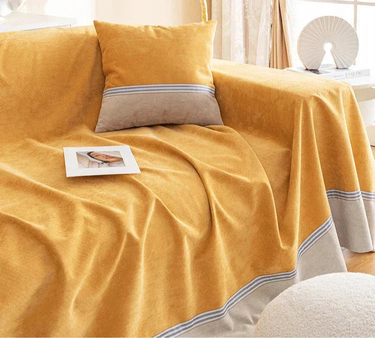 Quelle est la différence entre un jeté de canapé et une housse de canapé ?