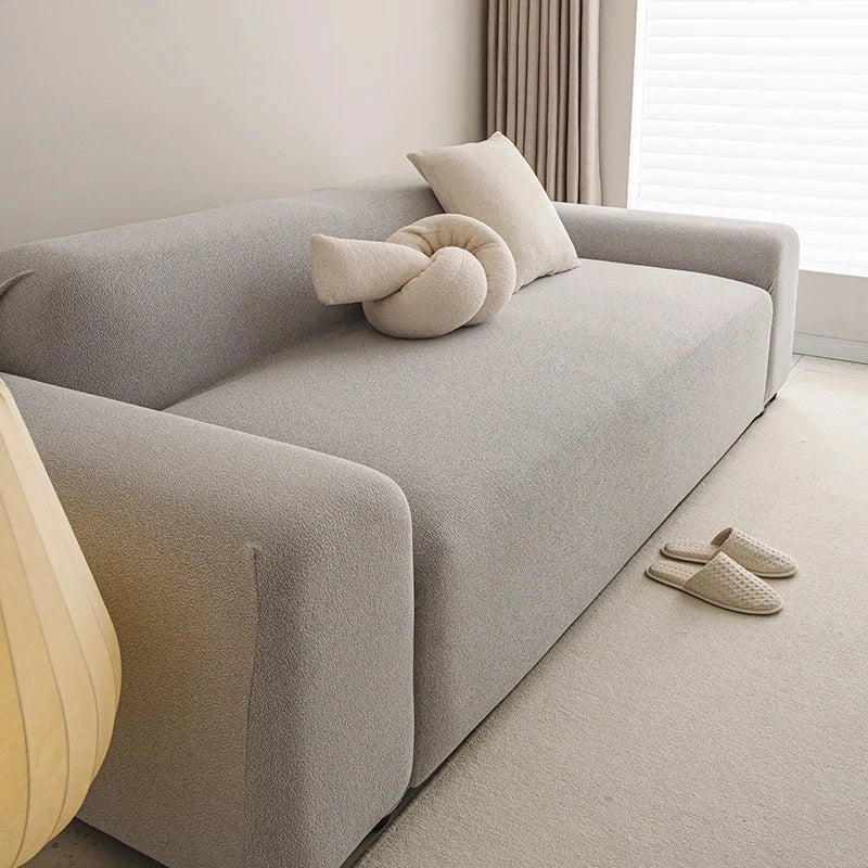 Housse de canapé extensible haut de gamme déperlante texture teddy gris clair